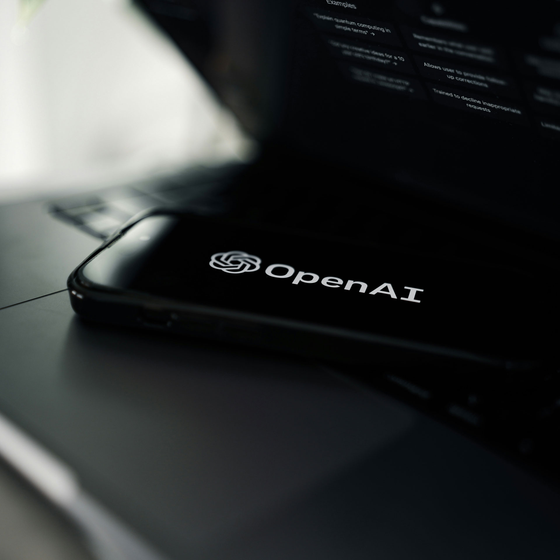 OpenAI logo on a cellphone